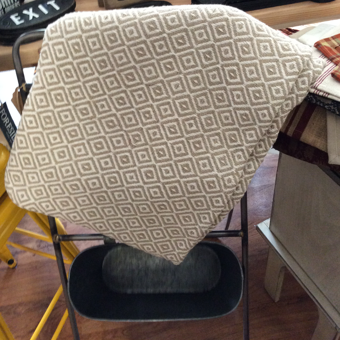 Fresh mid-tone colors in soft yellow and blue pop against deeper shades of cayenne and nutmeg.