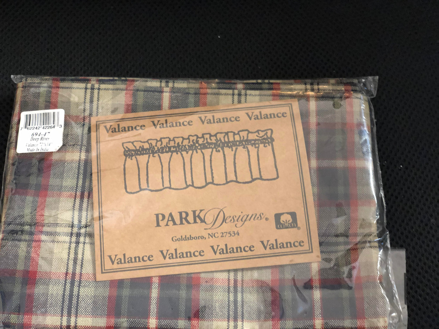 Handsome rich tones of navy, dark red and khaki green are woven into the back drop of a farmhouse tan to create the plaid in the Deep River Lined Layered Valance.