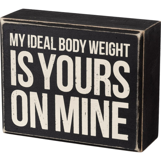 A classic wooden box sign featuring a "My Ideal Body Weight Is Yours On Mine" sentiment. 