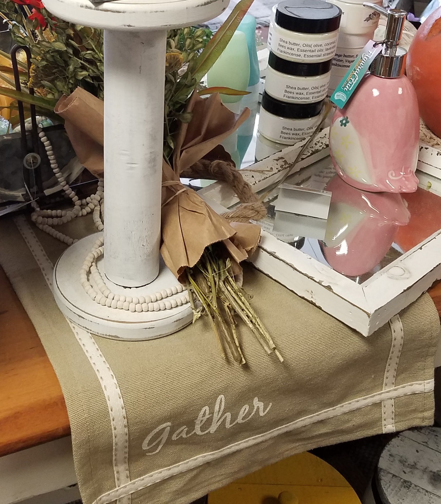 farmhouse table runner that has the word "Gather" on one end and "Family" on the other