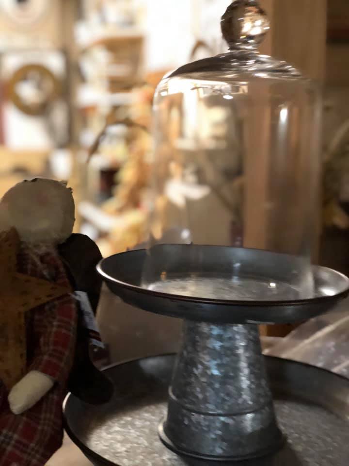 candle cover bell jar on metal risers for table top.. Its unique design allows fragrance oils from the candle's scented wax to accumulate on inside top of bell jar and create a built-in fragrance tester.