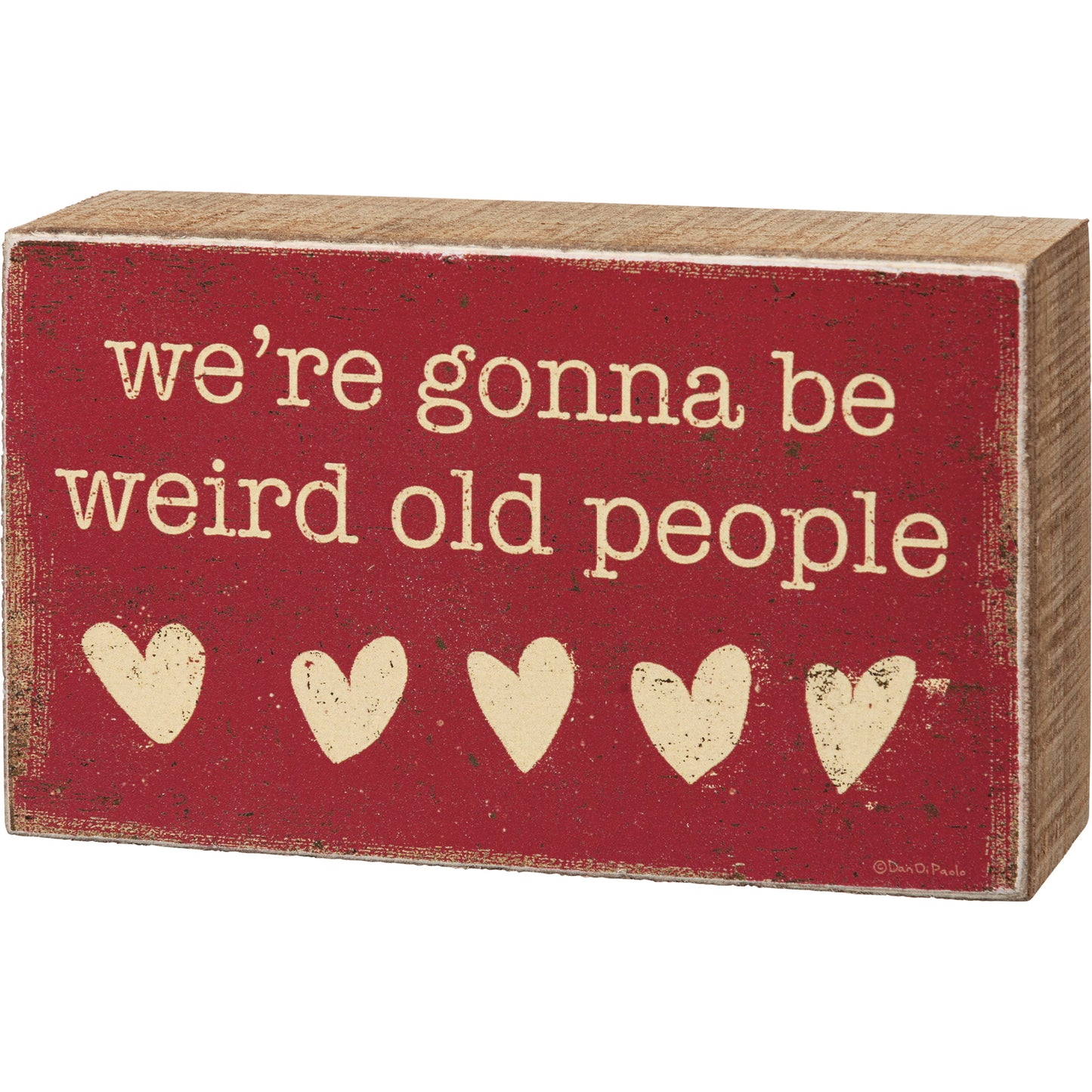 A wooden box sign featuring a rustic hearts design with "We're Gonna Be Weird Old People" sentiment.