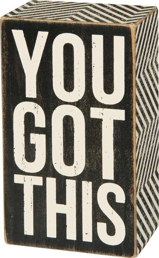 A classic black and white wooden box sign featuring a distressed "You Got This" sentiment with zigzag trim designs.