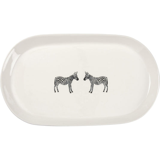A stoneware oval platter featuring printed zebras in the center.
