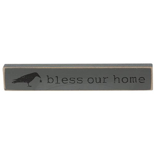 Live Simply Mini Stick is a wooden quote stick that comes in three assorted designs. Each stick reads, "gather," "bless our home," or, "live simply" and is accented with farmhouse illustrations like five-point stars, a crow, and a windmill. Stick has a flat bottom for shelf or tabletop display and measures 1" high by 6" wide.